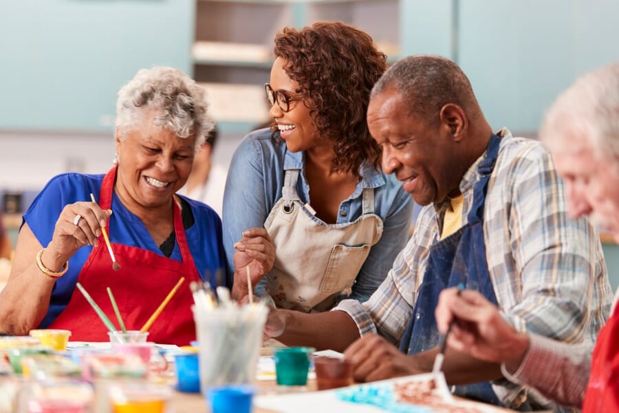 Senior citizens laughing at a retirement community