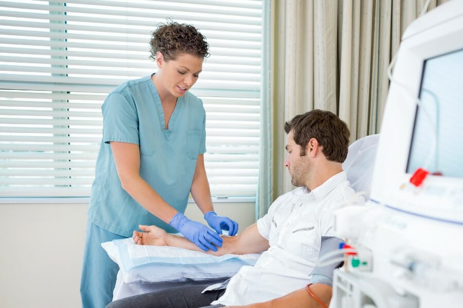 Local nurse preparing for an injection in her male patient.