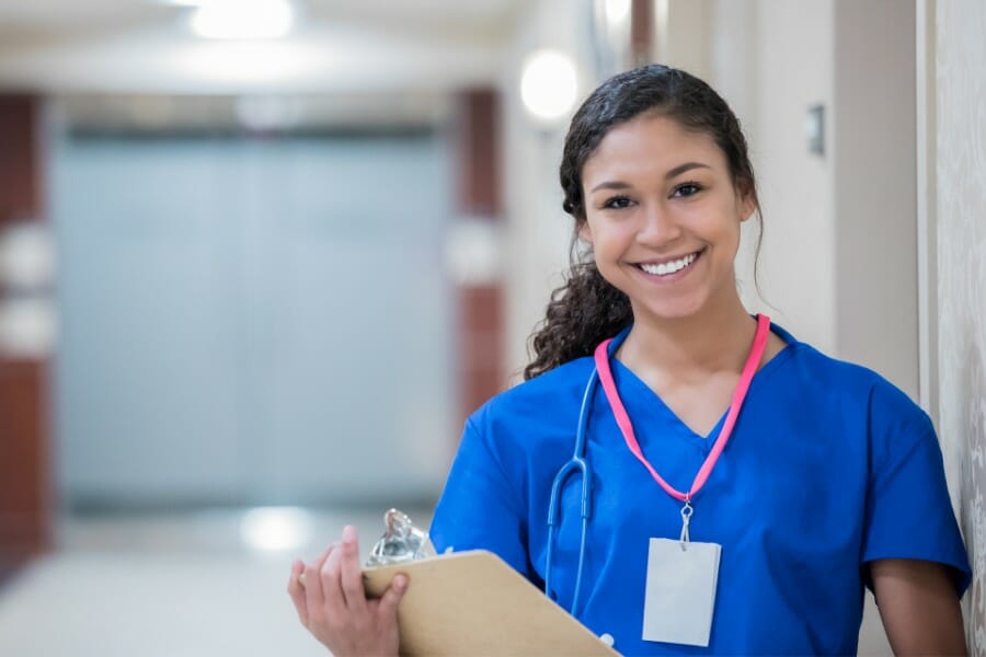 A smiling registered nurse in a local heatlhcare facility.