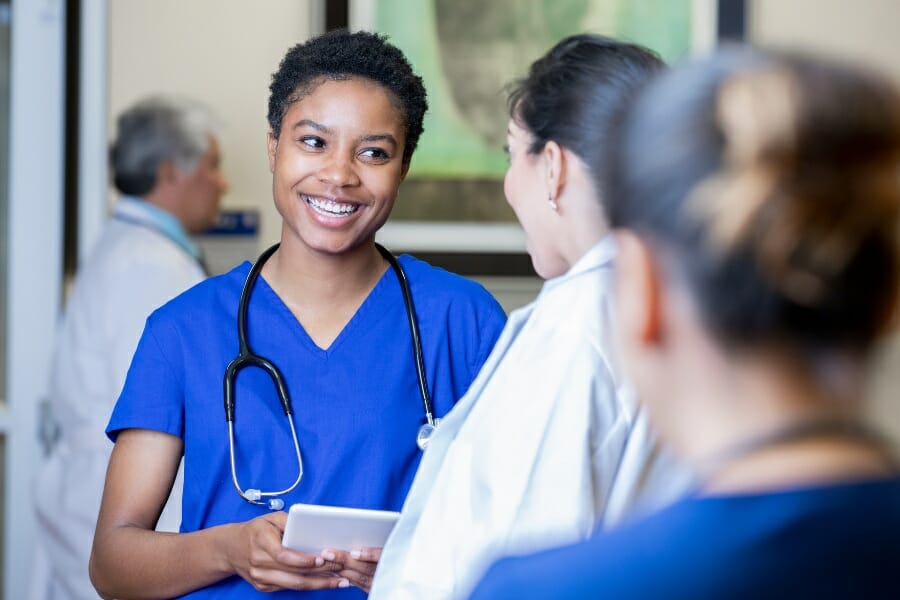 Nurses talking at a skilled nursing facility