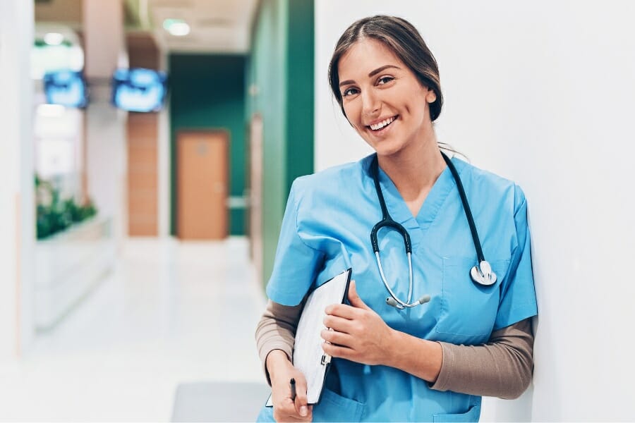 A nurse with a patient's chart in a hospital