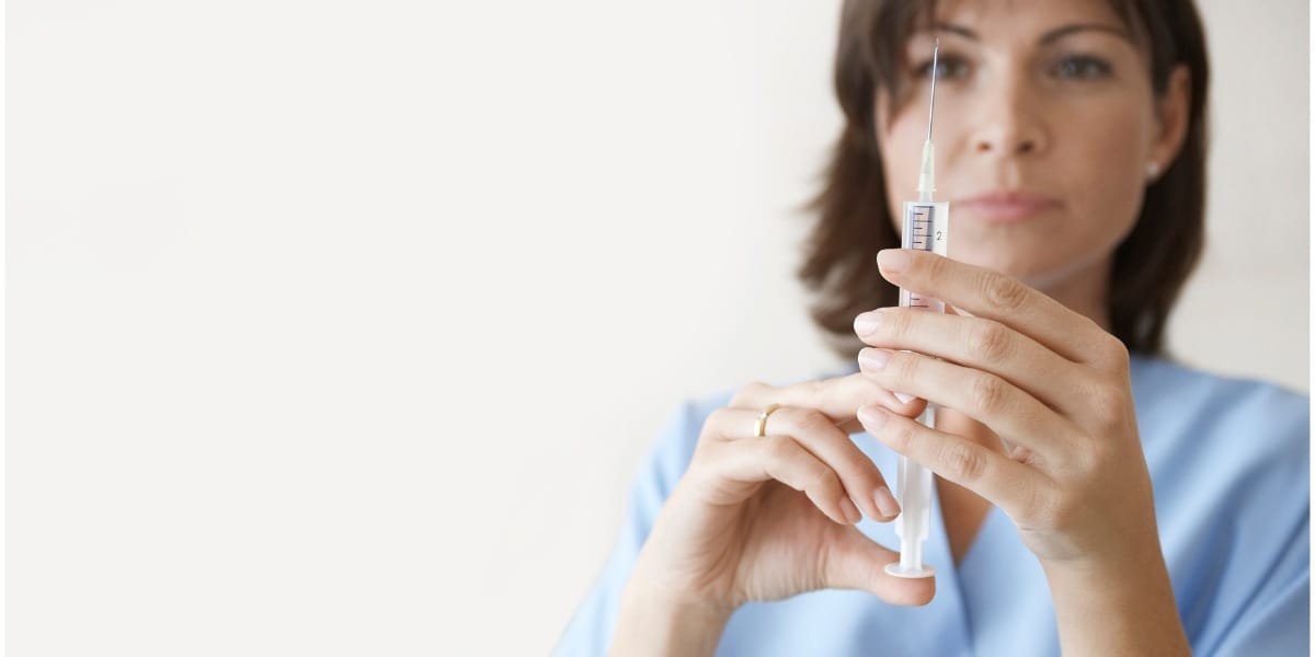 Nurse preparing for an injection