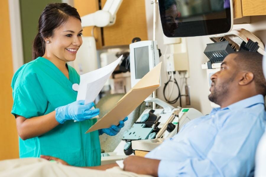 An RN talking with an injured patient