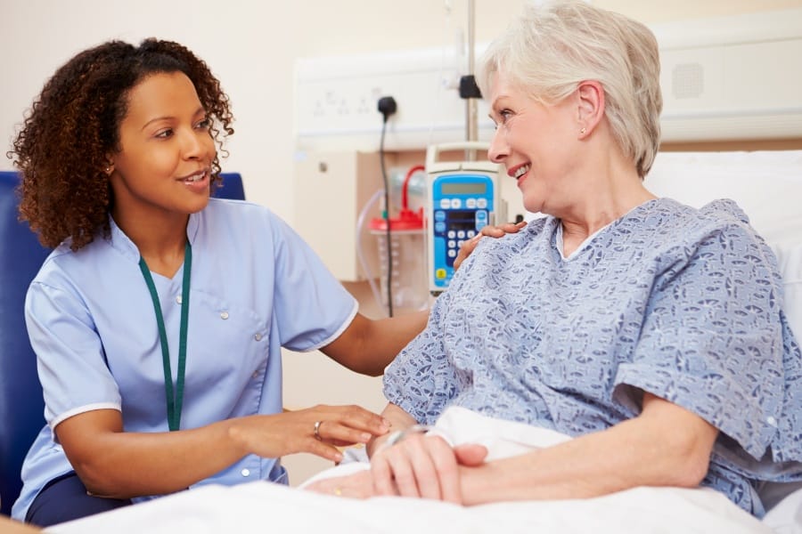 Nurse and an elderly patient in a Hayward, California skilled nursing facility