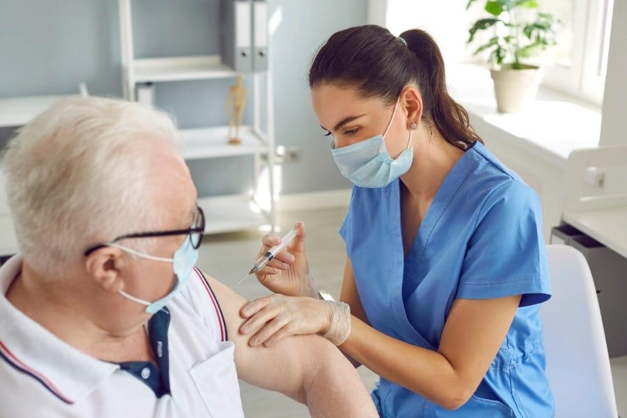 RN preparing a medication injection