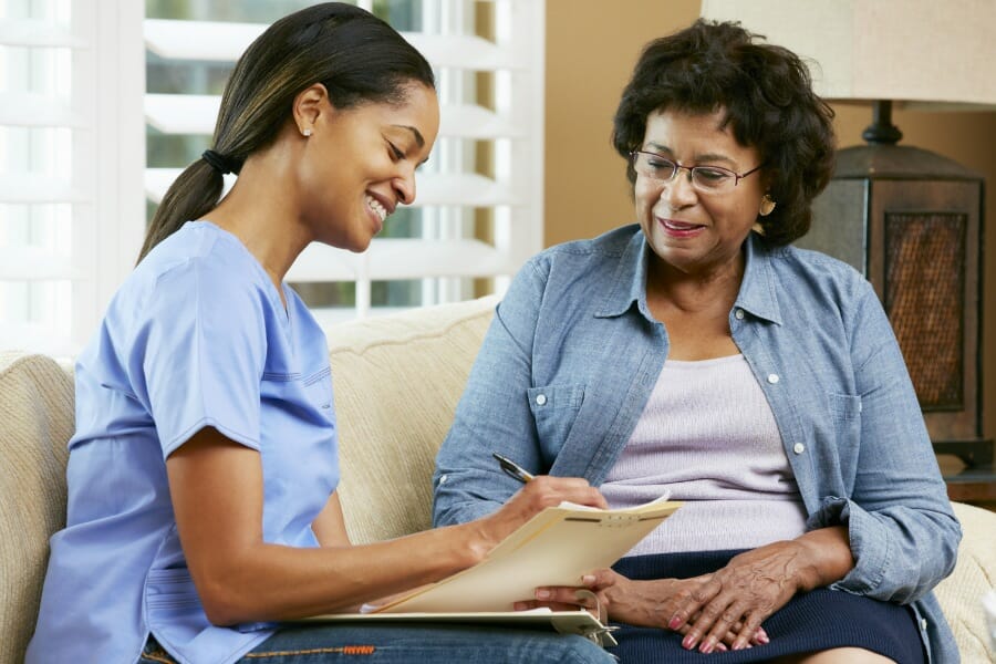 A nurse writing an assessment for a patient