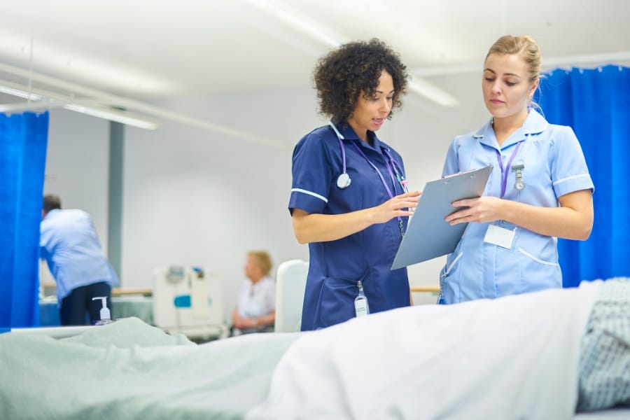 Nurses checking a patient chart