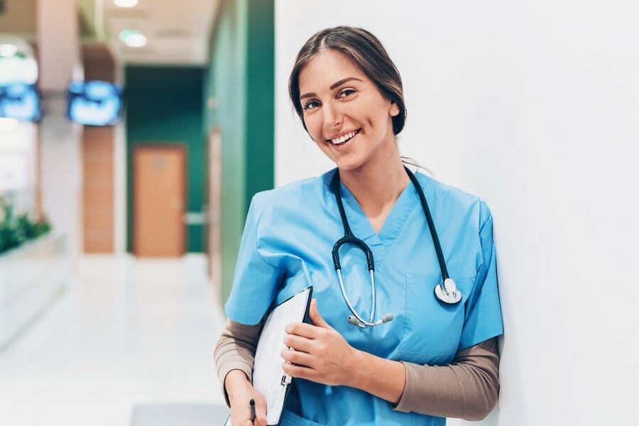 RN with a patient's chart in a hospital