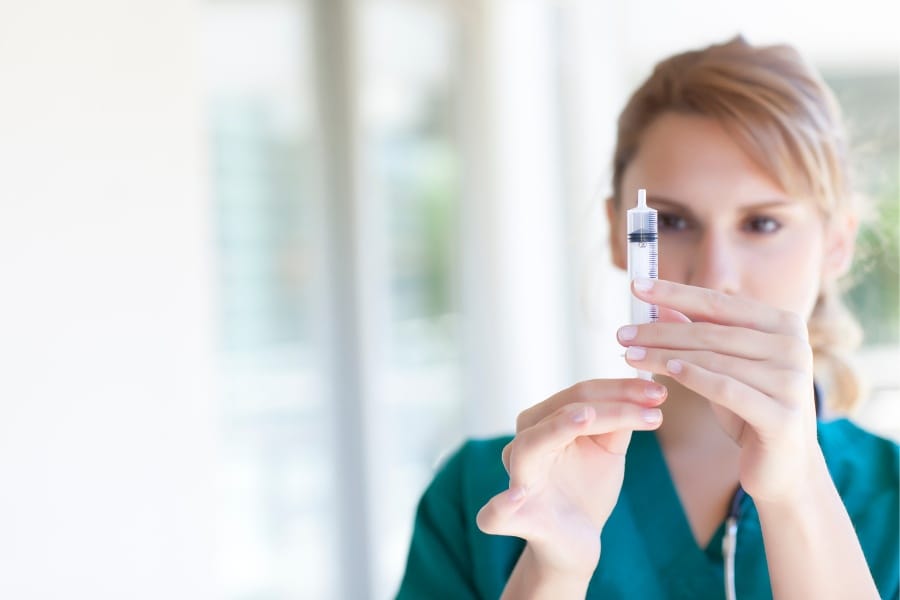 Local nurse preparing for an injection