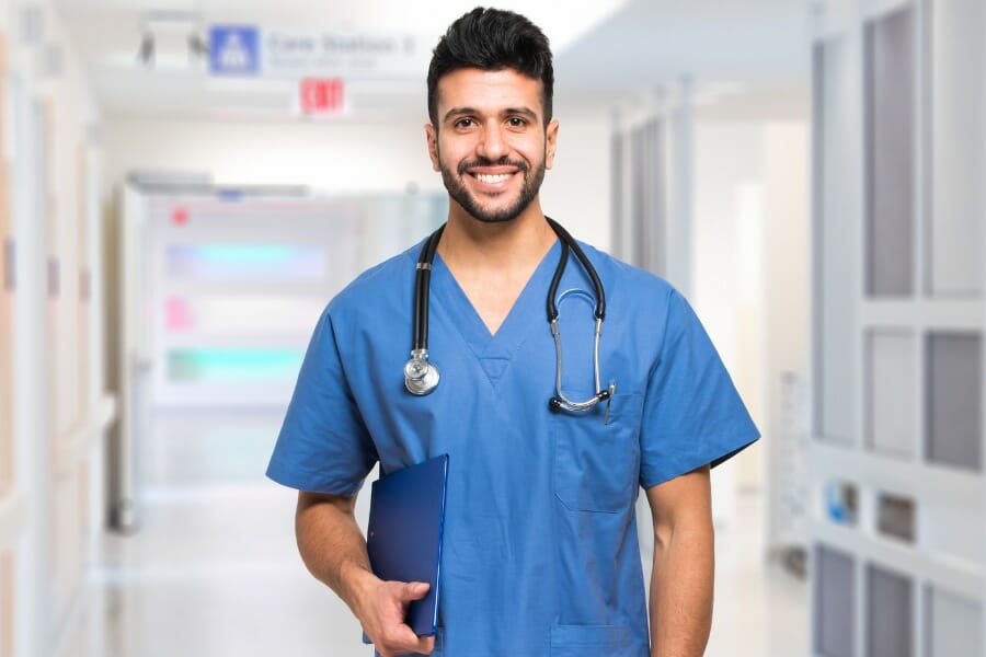 A male nurse smiling