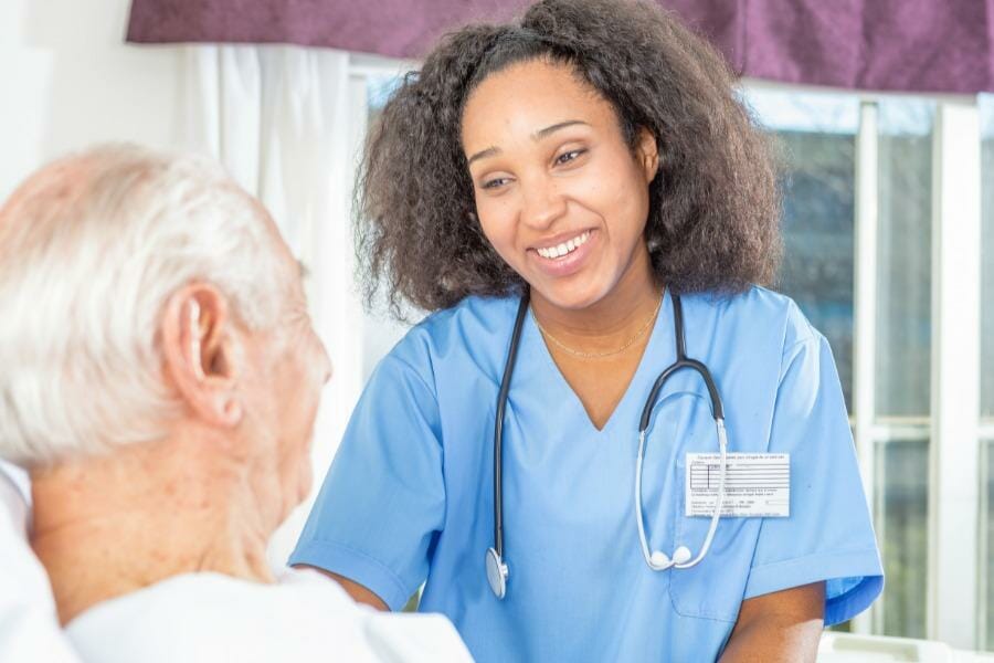 Nurse and her patient smiling