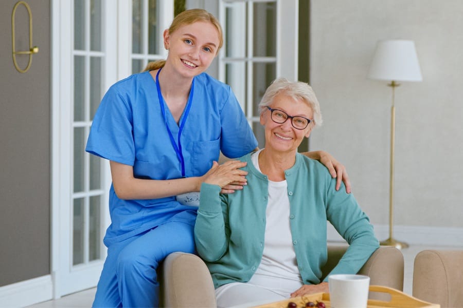 In home nurse and patient smiling