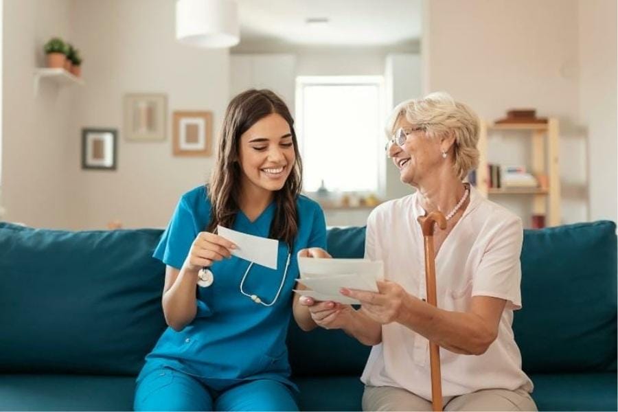 Florida LPN laughing with a patient in their home