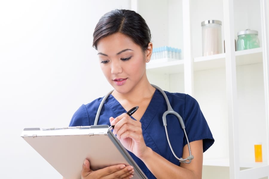 Local La Jolla nurse checking a patient's record