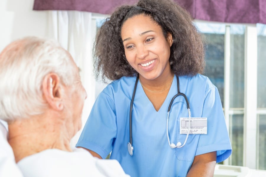 Home health LVN smiling with a patient