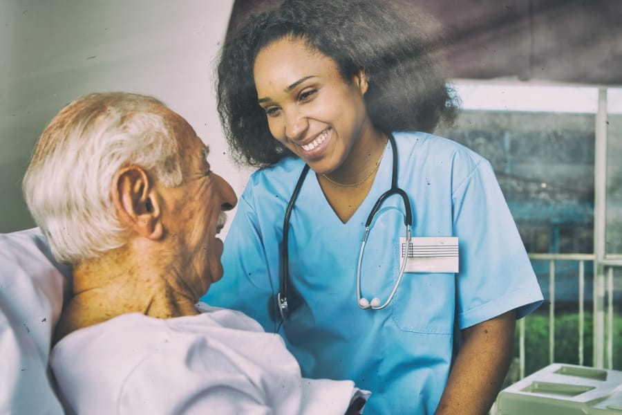 An RN with an elderly patient