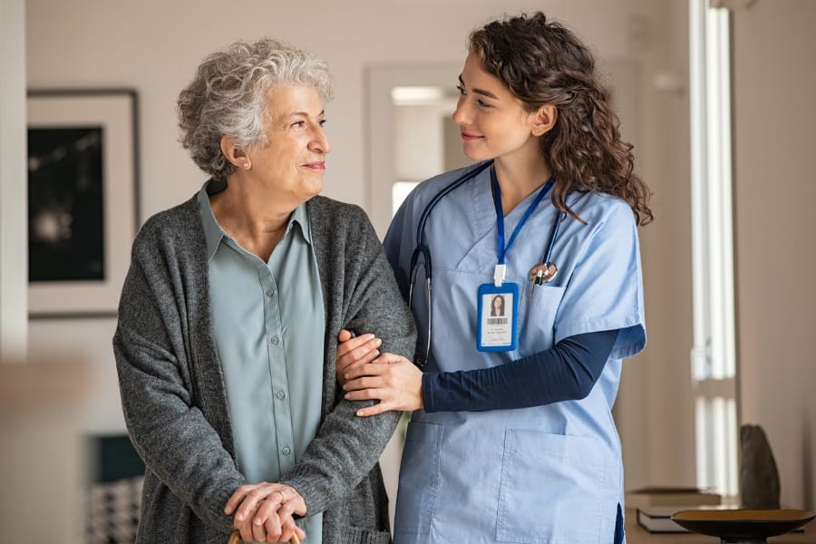 concierge nurse assisting an elderly client