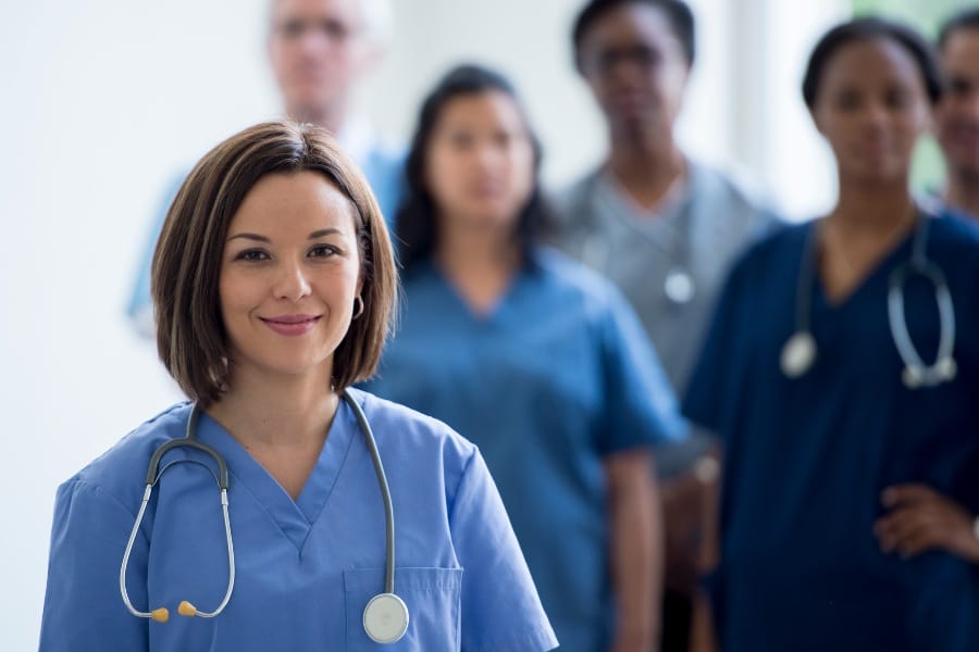 coral gables nurse staffing agency A group of nurses smiling in a local hospital