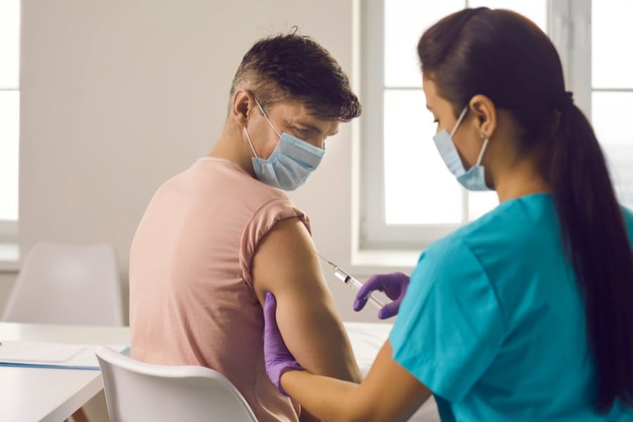 coral gables nurse staffing RN giving a patient an injection