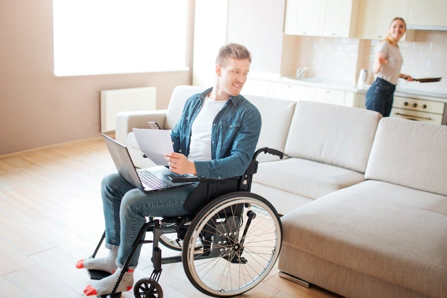 man in a wheelchair and his wife