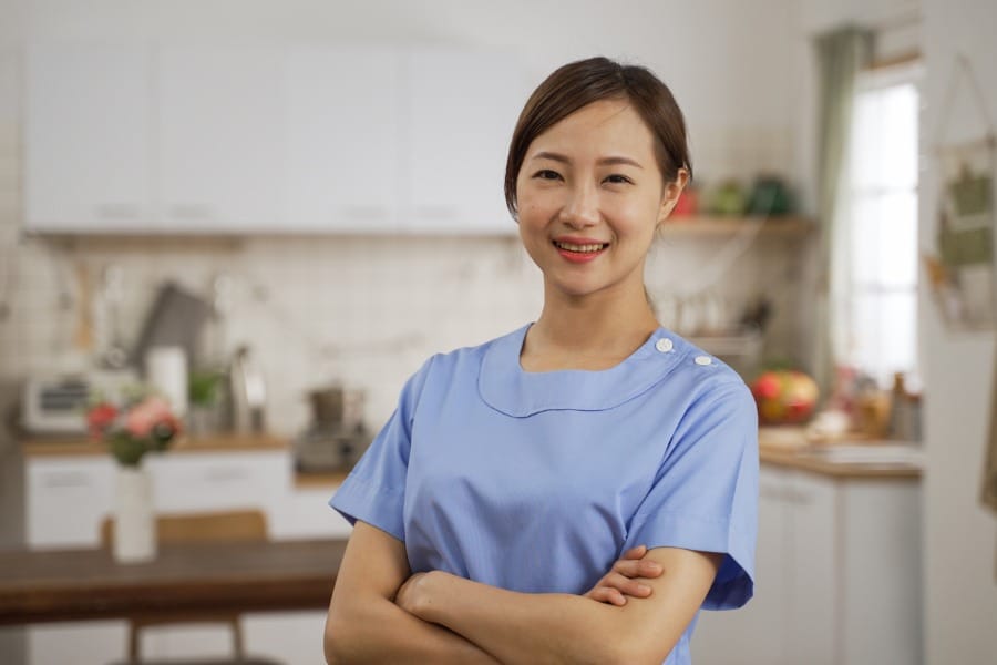A smiling home health nurse
