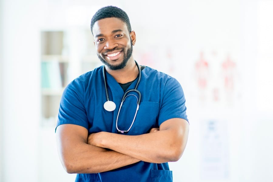 nurse outsourcing coral gables florida A nurse smiling at a healthcare facility