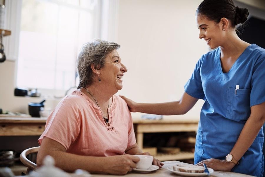 in home nurse with an elderly client