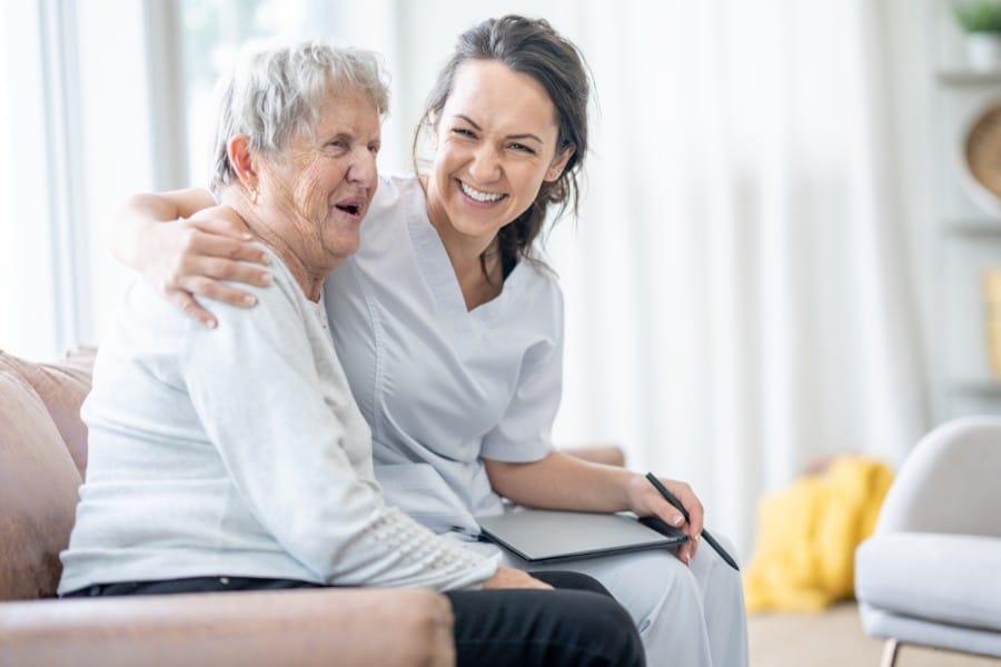 laughing nurse and patient