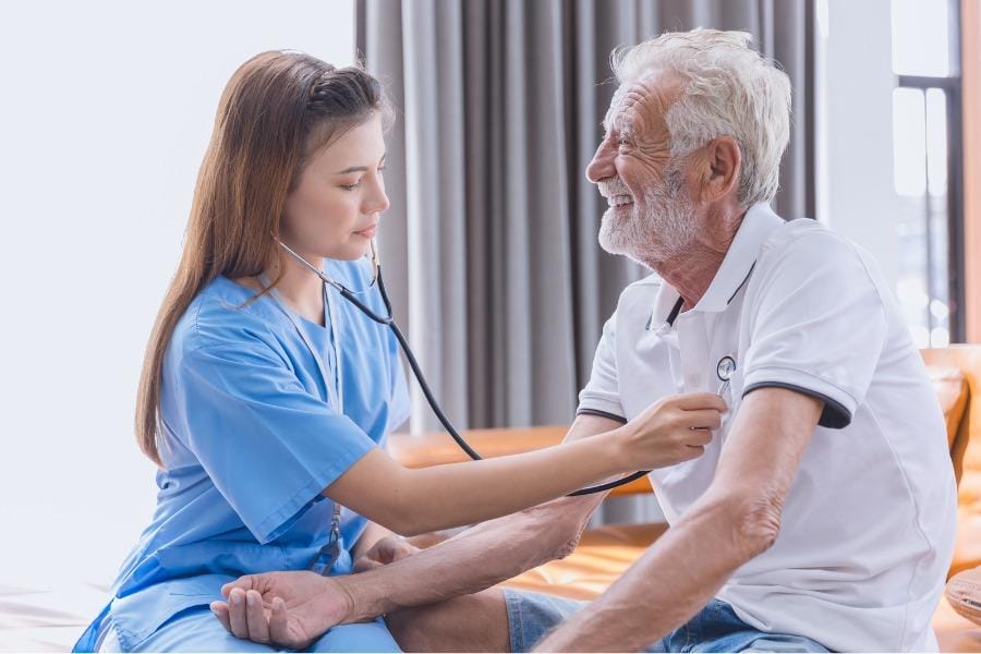 concierge nurse checking a client's heart