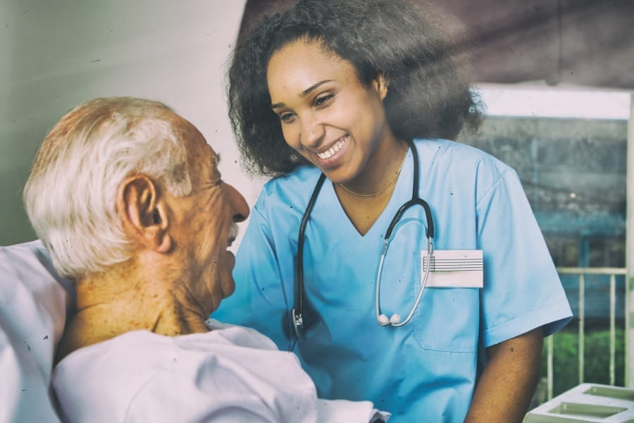 Smiling nurse and dementia client