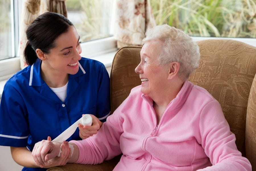 Nurse and client smiling