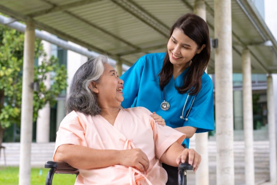 Nurse and her patient in a wheelchair