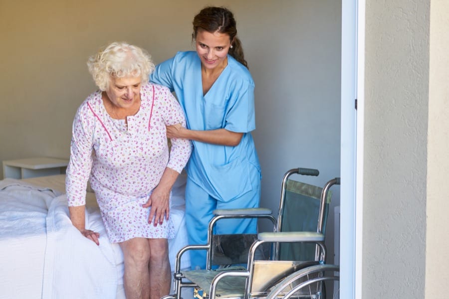 home health caregiver assisting her client