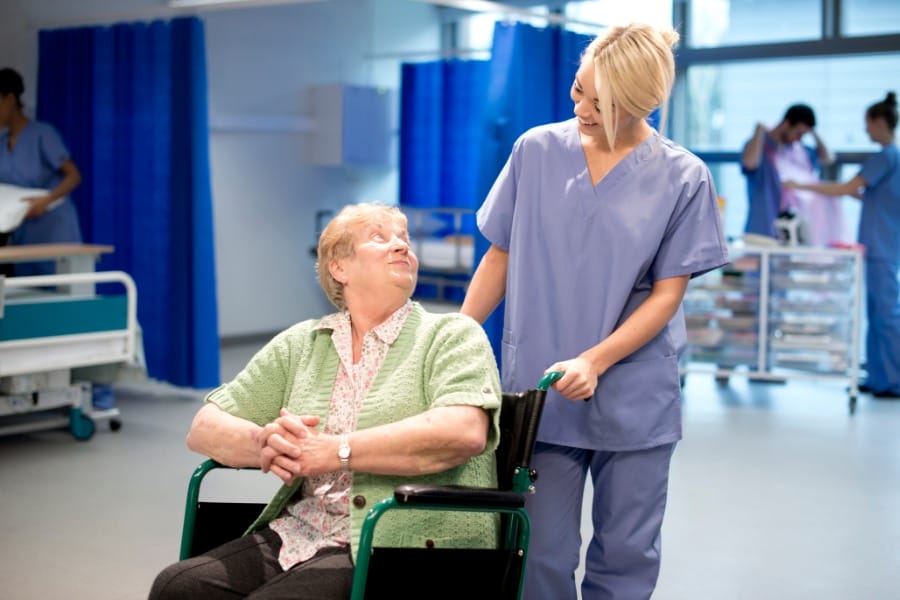 patient after a surgery and her nurse