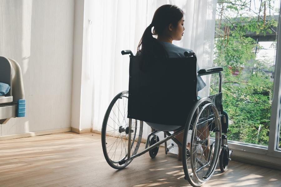 A woman with multiple sclerosis in a wheel chair