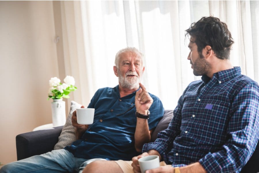 man with MS talking to a friend