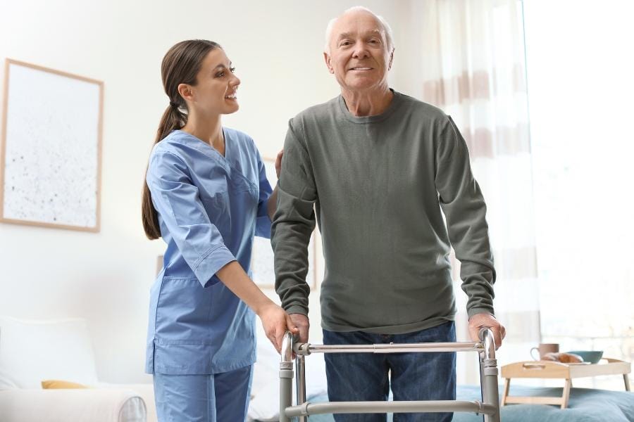 modesto ca in home nursing care LVN helping her client in with a walker move around