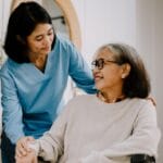 Menlo Park post op nurse with her client in a wheelchair