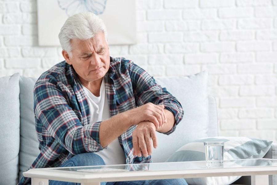 A man experiencing Parkinson's Disease symptoms