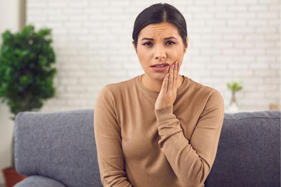 A woman's face swelling after plastic surgery