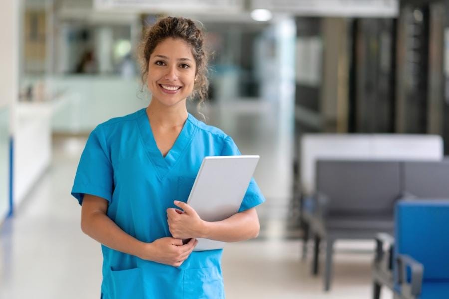 A smiling nurse in a healthcare facility
