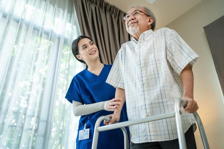 ms home care Home MS nurse with her elderly patient using a walker